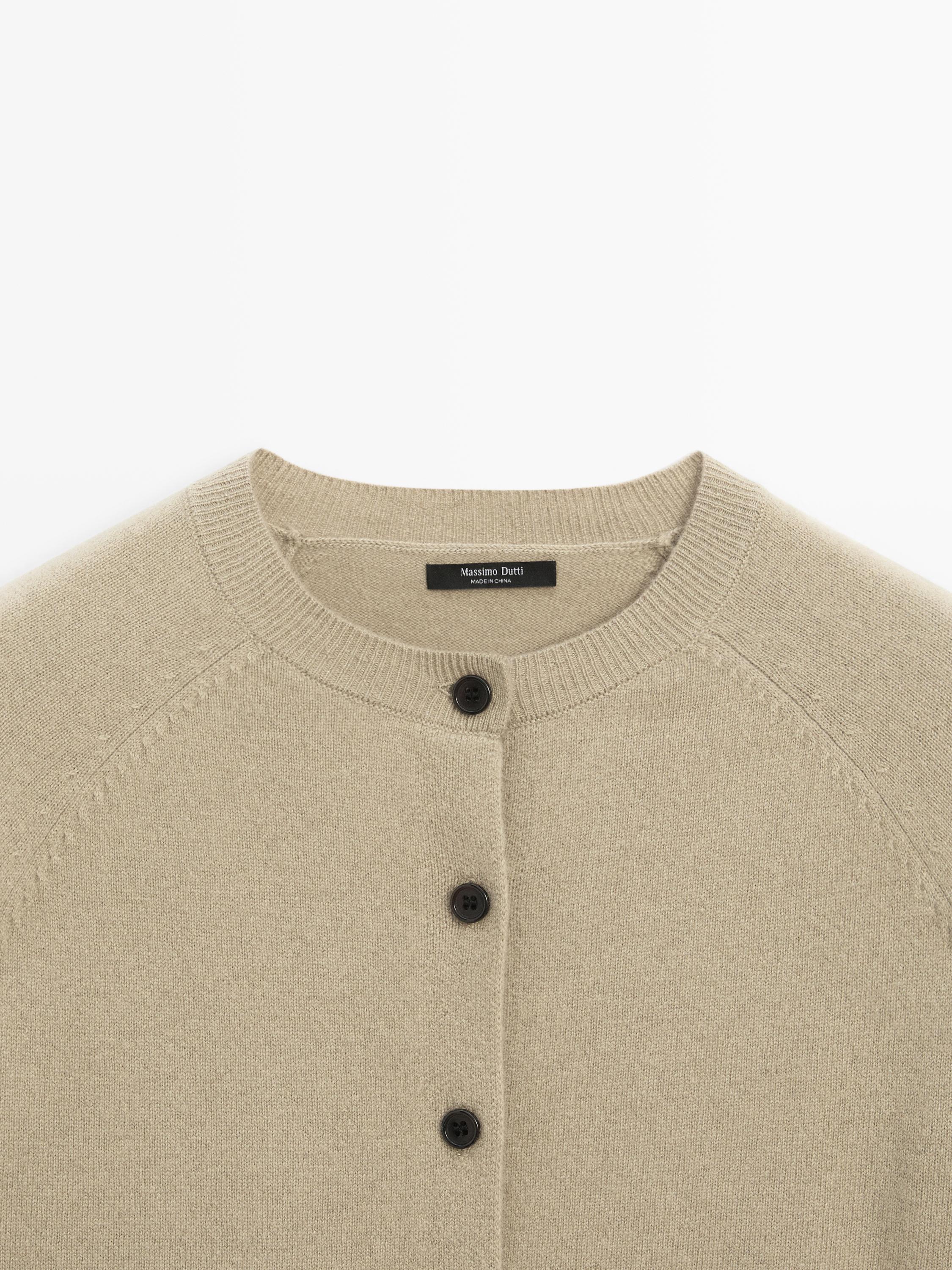 Short knit cardigan with raglan sleeves